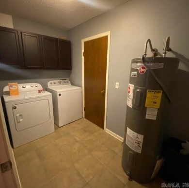 Charming and low-maintenance townhouse located in the heart of on DeSoto Golf Course in Arkansas - for sale on GolfHomes.com, golf home, golf lot
