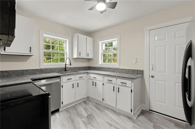 Discover this charming, updated 2-bedroom, 1-bathroom home with on John A. White Golf Course in Georgia - for sale on GolfHomes.com, golf home, golf lot