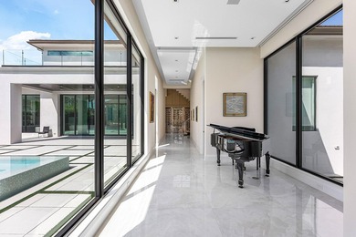 An architectural gem newly constructed in 2024, this on St. Andrews Country Club of Boca Raton in Florida - for sale on GolfHomes.com, golf home, golf lot