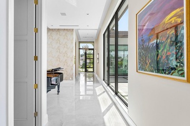 An architectural gem newly constructed in 2024, this on St. Andrews Country Club of Boca Raton in Florida - for sale on GolfHomes.com, golf home, golf lot