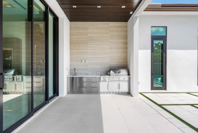 An architectural gem newly constructed in 2024, this on St. Andrews Country Club of Boca Raton in Florida - for sale on GolfHomes.com, golf home, golf lot