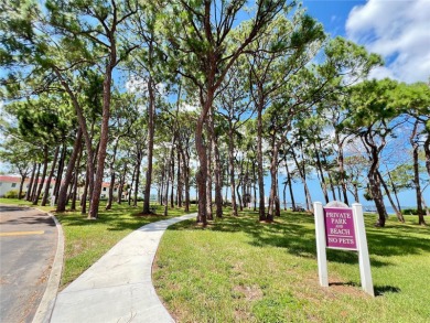 Location, Location! Waterfront community including a private on The Dunedin Country Club in Florida - for sale on GolfHomes.com, golf home, golf lot