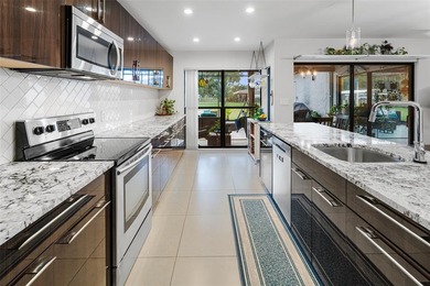 Step into Deer Creek's most sought-after villa--where modern on Deer Creek Golf Club in Florida - for sale on GolfHomes.com, golf home, golf lot