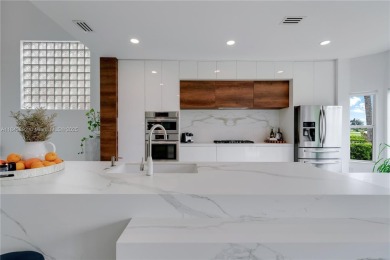 Golf and lake view gem in gated Doral Palms Estates! Enjoy on Jim McLean Signature Course in Florida - for sale on GolfHomes.com, golf home, golf lot
