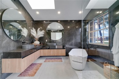 Golf and lake view gem in gated Doral Palms Estates! Enjoy on Jim McLean Signature Course in Florida - for sale on GolfHomes.com, golf home, golf lot