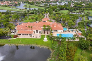 Golf and lake view gem in gated Doral Palms Estates! Enjoy on Jim McLean Signature Course in Florida - for sale on GolfHomes.com, golf home, golf lot