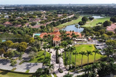 Golf and lake view gem in gated Doral Palms Estates! Enjoy on Jim McLean Signature Course in Florida - for sale on GolfHomes.com, golf home, golf lot