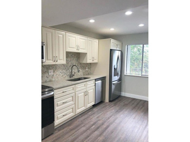 Beautiful updated 3 bedroom 2 bath condo with lake view.  Open on Fountains Golf and Country Club in Florida - for sale on GolfHomes.com, golf home, golf lot