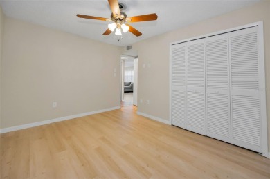 This Happy Home has been freshly updated to brand new!  Located on Countryside Country Club in Florida - for sale on GolfHomes.com, golf home, golf lot