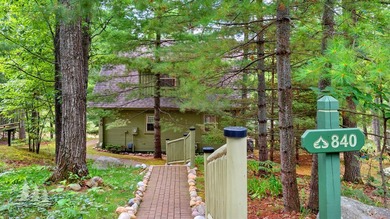 Tucked within the Garland Golf Resort, this beautifully updated on Garland Resort and Golf Club  in Michigan - for sale on GolfHomes.com, golf home, golf lot