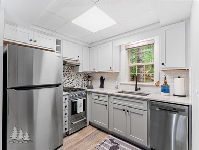 Tucked within the Garland Golf Resort, this beautifully updated on Garland Resort and Golf Club  in Michigan - for sale on GolfHomes.com, golf home, golf lot