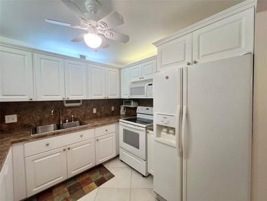 NEW A/C! HIGHLY DESIRABLE BUILDING LOCATED NEAR THE CLUBHOUSE on Hillsboro Pines Golf in Florida - for sale on GolfHomes.com, golf home, golf lot
