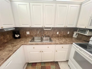 NEW A/C! HIGHLY DESIRABLE BUILDING LOCATED NEAR THE CLUBHOUSE on Hillsboro Pines Golf in Florida - for sale on GolfHomes.com, golf home, golf lot