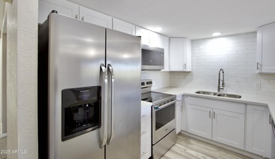 Beautifully remodeled 3-bedroom, 2-bath, two-story townhome! on Fountain of the Sun Country Club in Arizona - for sale on GolfHomes.com, golf home, golf lot