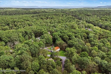 Welcome to 102 Tulip Trail, nestled in the sought-after Pocono on Pocono Farms Country Club in Pennsylvania - for sale on GolfHomes.com, golf home, golf lot