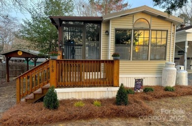 Welcome to your lake getaway at Twin Harbor, whether you are on The Tillery Tradition Country Club in North Carolina - for sale on GolfHomes.com, golf home, golf lot