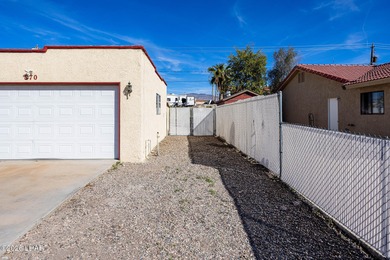 Located in the heart of Lake Havasu City, this 3-bedroom, 2-bath on London Bridge Golf Course in Arizona - for sale on GolfHomes.com, golf home, golf lot