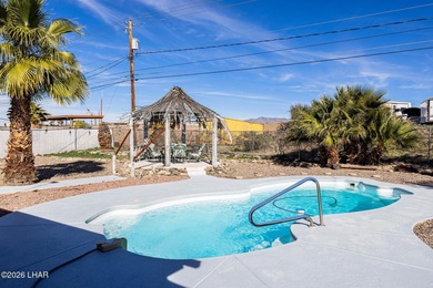 Located in the heart of Lake Havasu City, this 3-bedroom, 2-bath on London Bridge Golf Course in Arizona - for sale on GolfHomes.com, golf home, golf lot