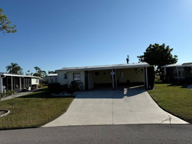 This lovely, manufactured home is in Lake Fairways Country Club on Pine Lakes Country Club in Florida - for sale on GolfHomes.com, golf home, golf lot