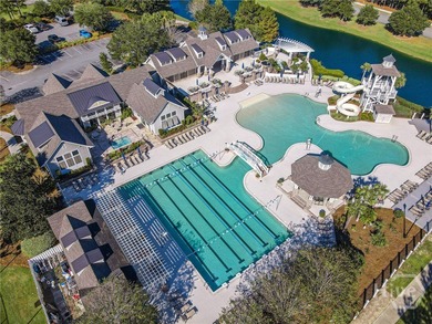 Discover a rare opportunity to own 121 feet of peaceful lagoon on Savannah Quarters Country Club in Georgia - for sale on GolfHomes.com, golf home, golf lot