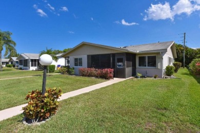 RARE HALF DUPLEX WITH PRIVATE BACKYARD! This 2-bedroom on Cypress Lakes Golf Course - West Palm Beach in Florida - for sale on GolfHomes.com, golf home, golf lot