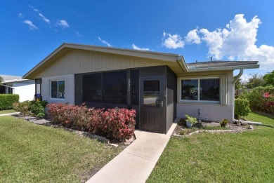 RARE HALF DUPLEX WITH PRIVATE BACKYARD! This 2-bedroom on Cypress Lakes Golf Course - West Palm Beach in Florida - for sale on GolfHomes.com, golf home, golf lot