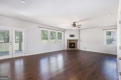 Experience golf course living at its finest in this spacious on Mirror Lake Golf Club in Georgia - for sale on GolfHomes.com, golf home, golf lot