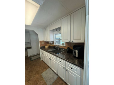 Here's a great house that offers a lot of value and is turnkey on The Meadows At Countrywood in Florida - for sale on GolfHomes.com, golf home, golf lot