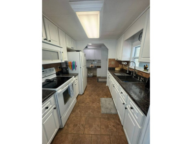 Here's a great house that offers a lot of value and is turnkey on The Meadows At Countrywood in Florida - for sale on GolfHomes.com, golf home, golf lot