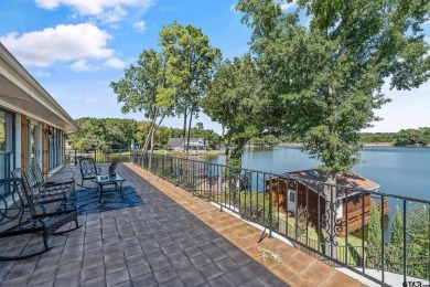 This beautiful lakefront property in Hideaway offers everything on Hide-A-Way Lake Golf Course in Texas - for sale on GolfHomes.com, golf home, golf lot