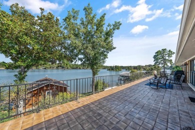 This beautiful lakefront property in Hideaway offers everything on Hide-A-Way Lake Golf Course in Texas - for sale on GolfHomes.com, golf home, golf lot