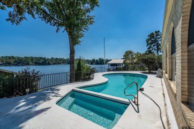 This beautiful lakefront property in Hideaway offers everything on Hide-A-Way Lake Golf Course in Texas - for sale on GolfHomes.com, golf home, golf lot