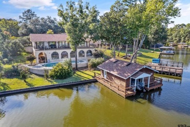 This beautiful lakefront property in Hideaway offers everything on Hide-A-Way Lake Golf Course in Texas - for sale on GolfHomes.com, golf home, golf lot