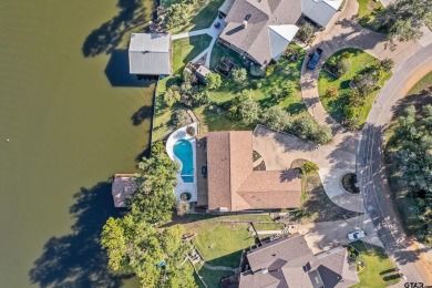 This beautiful lakefront property in Hideaway offers everything on Hide-A-Way Lake Golf Course in Texas - for sale on GolfHomes.com, golf home, golf lot