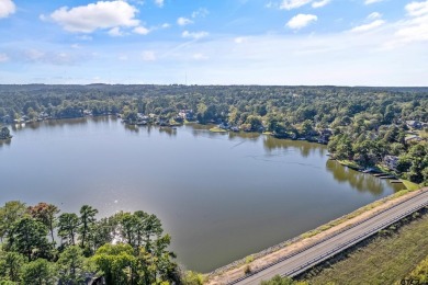 This beautiful lakefront property in Hideaway offers everything on Hide-A-Way Lake Golf Course in Texas - for sale on GolfHomes.com, golf home, golf lot