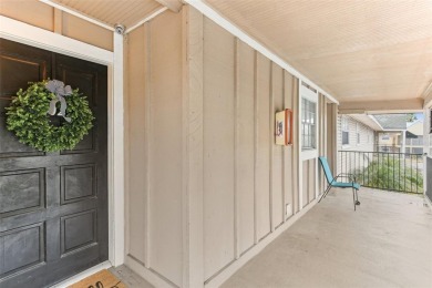 Welcome to this delightful second-floor end-unit condo, offering on East Bay Golf Club in Florida - for sale on GolfHomes.com, golf home, golf lot
