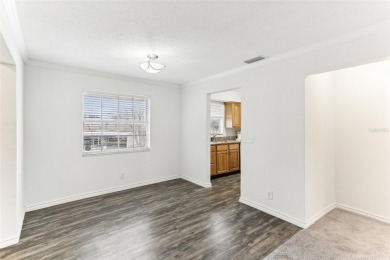 Welcome to this delightful second-floor end-unit condo, offering on East Bay Golf Club in Florida - for sale on GolfHomes.com, golf home, golf lot