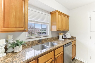 Welcome to this delightful second-floor end-unit condo, offering on East Bay Golf Club in Florida - for sale on GolfHomes.com, golf home, golf lot