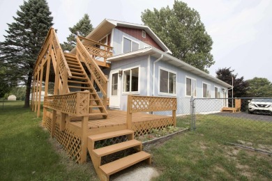 This peaceful Harrisville home, nestled along the fairways of on Greenbush Golf Course in Michigan - for sale on GolfHomes.com, golf home, golf lot