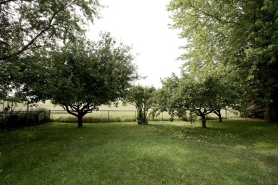 This peaceful Harrisville home, nestled along the fairways of on Greenbush Golf Course in Michigan - for sale on GolfHomes.com, golf home, golf lot