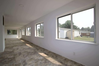 This peaceful Harrisville home, nestled along the fairways of on Greenbush Golf Course in Michigan - for sale on GolfHomes.com, golf home, golf lot
