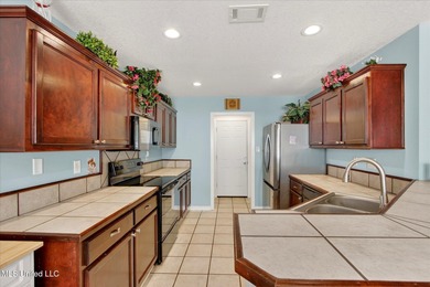 This well-maintained 3-bedroom, 2-bath brick home offers comfort on Diamondhead Country Club in Mississippi - for sale on GolfHomes.com, golf home, golf lot