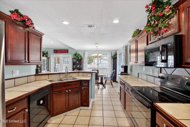 This well-maintained 3-bedroom, 2-bath brick home offers comfort on Diamondhead Country Club in Mississippi - for sale on GolfHomes.com, golf home, golf lot