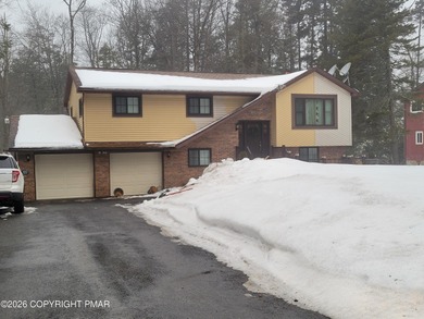 Experience the perfect blend of mountain serenity and modern on Pocono Farms Country Club in Pennsylvania - for sale on GolfHomes.com, golf home, golf lot