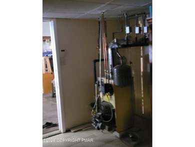 Experience the perfect blend of mountain serenity and modern on Pocono Farms Country Club in Pennsylvania - for sale on GolfHomes.com, golf home, golf lot