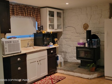 Experience the perfect blend of mountain serenity and modern on Pocono Farms Country Club in Pennsylvania - for sale on GolfHomes.com, golf home, golf lot