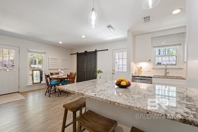 This charming, updated home with a wraparound front porch is on Lake Forest Yacht and Country Club in Alabama - for sale on GolfHomes.com, golf home, golf lot