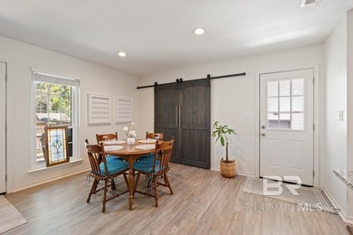 This charming, updated home with a wraparound front porch is on Lake Forest Yacht and Country Club in Alabama - for sale on GolfHomes.com, golf home, golf lot