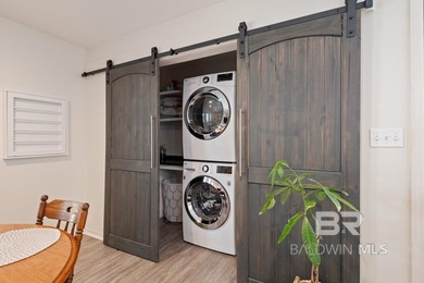 This charming, updated home with a wraparound front porch is on Lake Forest Yacht and Country Club in Alabama - for sale on GolfHomes.com, golf home, golf lot