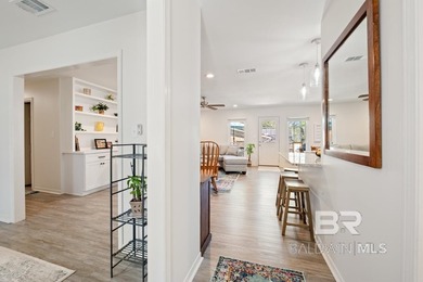 This charming, updated home with a wraparound front porch is on Lake Forest Yacht and Country Club in Alabama - for sale on GolfHomes.com, golf home, golf lot